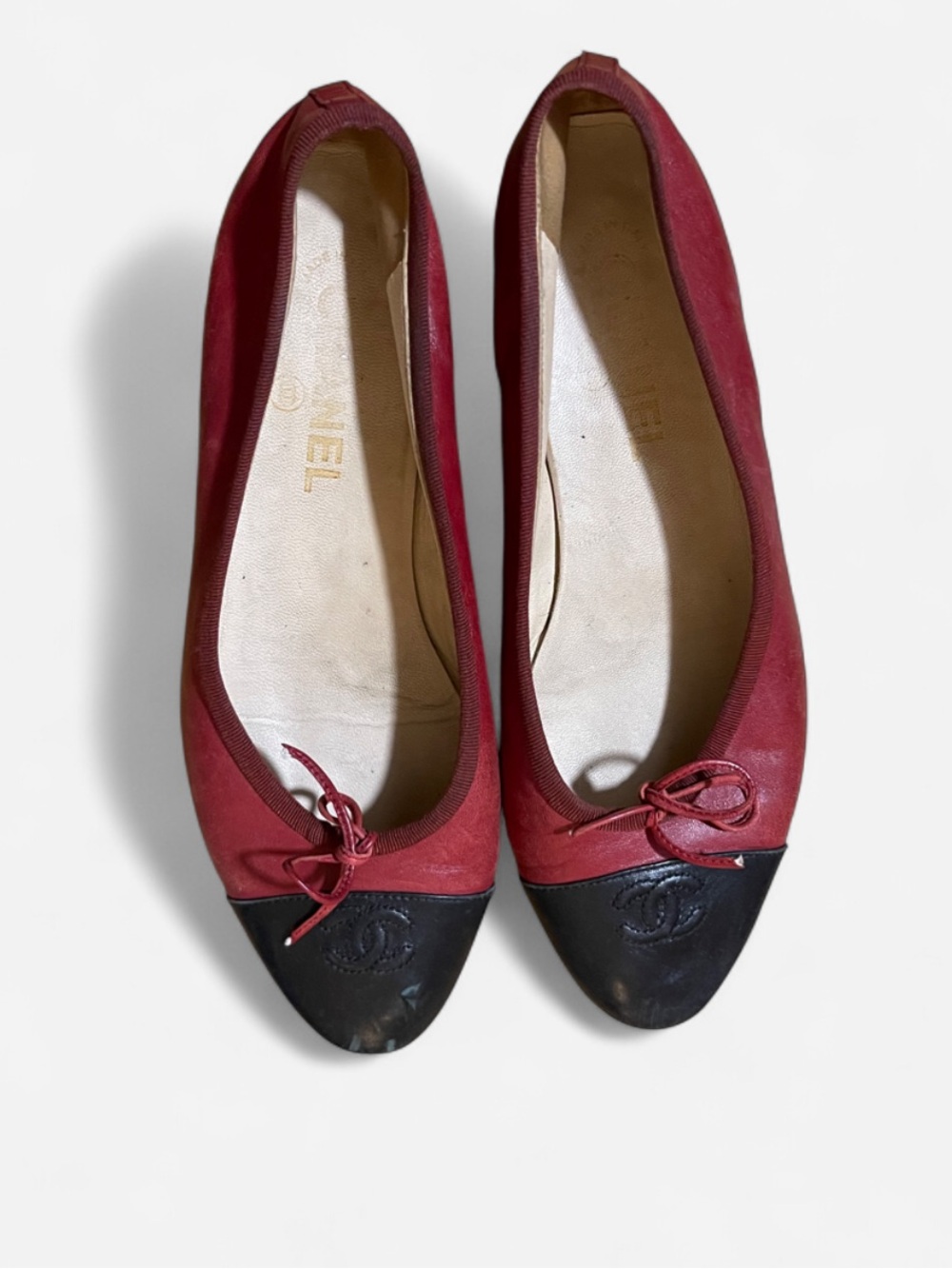 CHANEL Red Leather Ballet Flats with Black Cap Toe